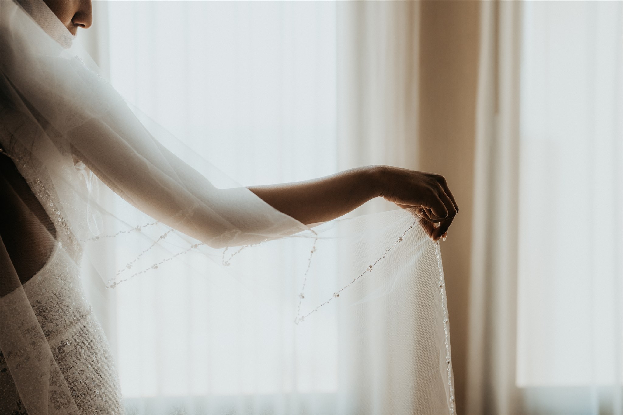 Bride holding veil before Big Sur elopement