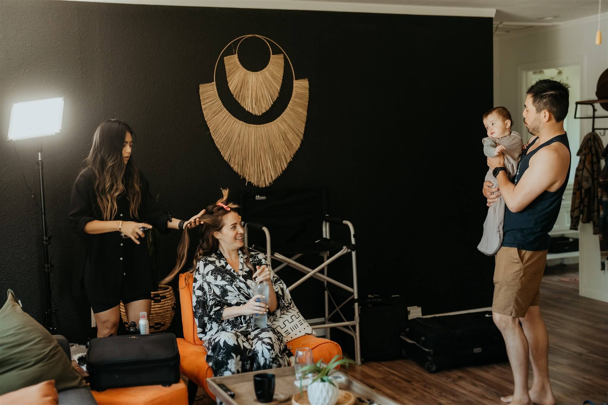 Bride getting hair done before elopement with family